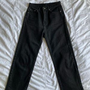 Raw-hemmed black jeans